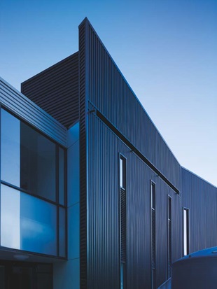 Steel plays a starring role at the entry to each SWIS, were a two-storey-high inverted L-shaped canopy is clad in Stramit Longspan® made from COLORBOND® steel that touches the ground